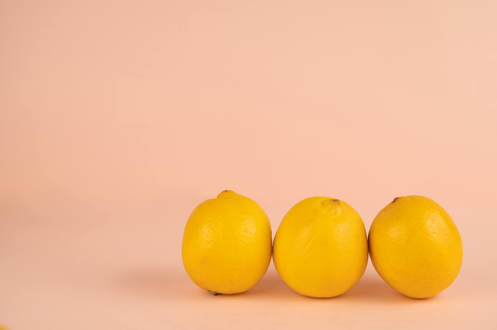 Bright yellow lemons on a soft green background, symbolizing fresh starts and renewal